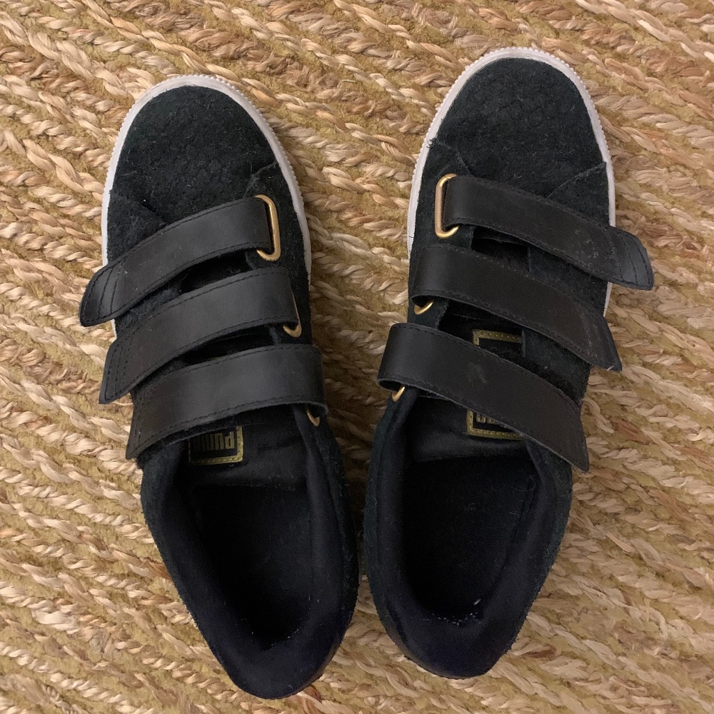Black Puma velcro sneakers with gold hardware
